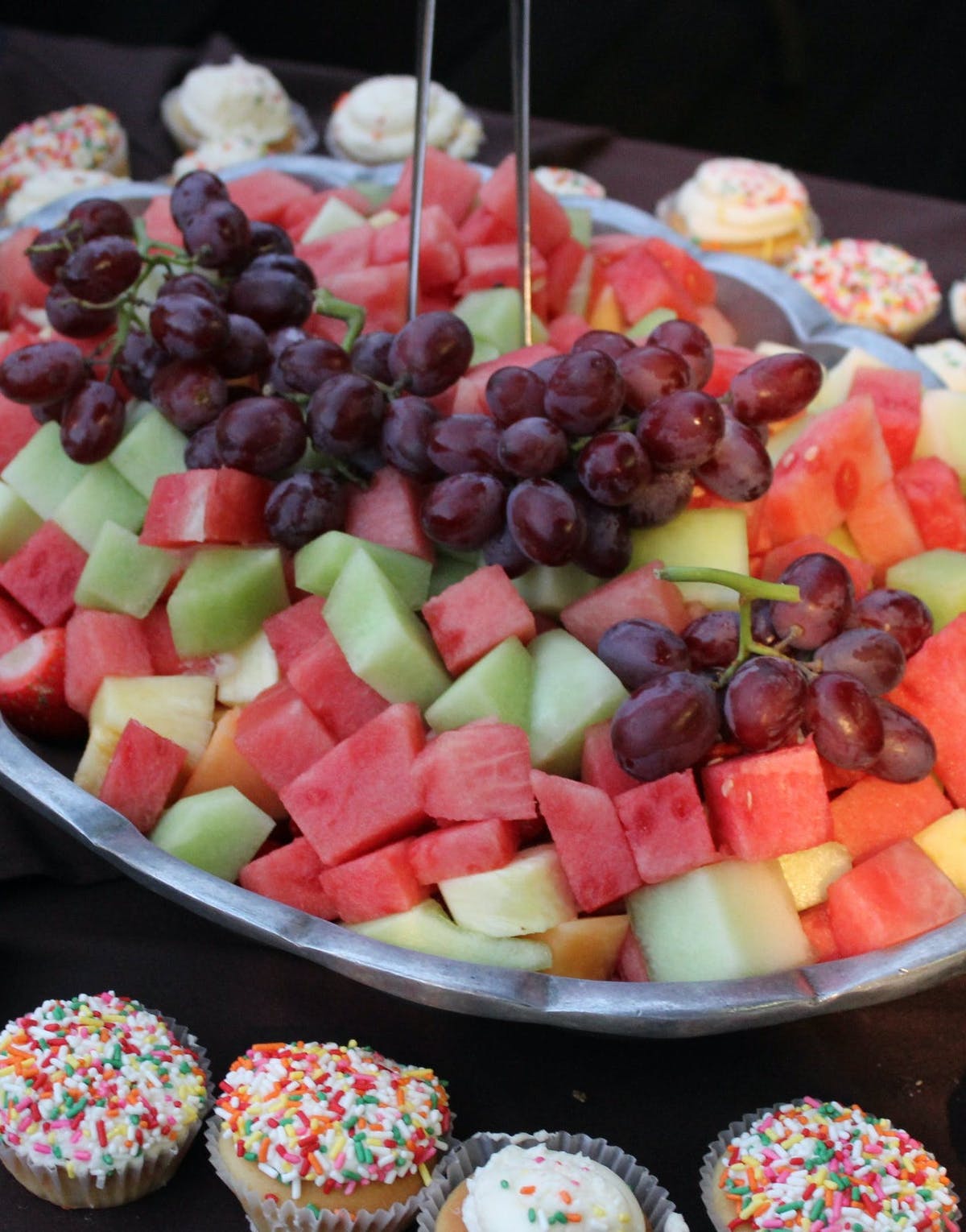 a bowl of fruit on a plate